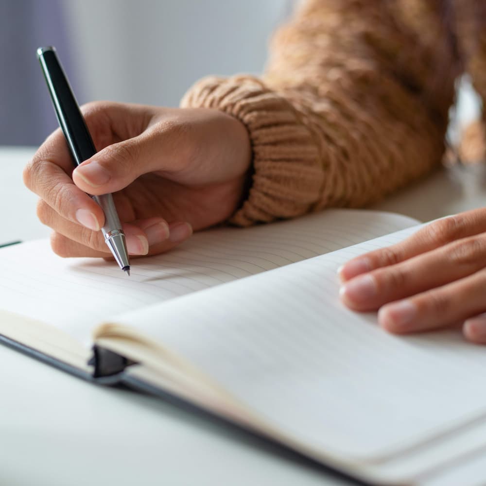 Woman planning schedule, representing MBA essay preparation