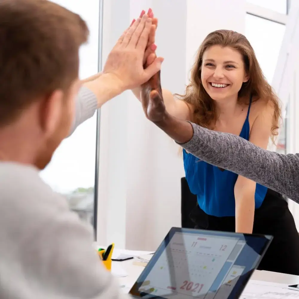 Team celebrating undergraduate and MBA admissions success